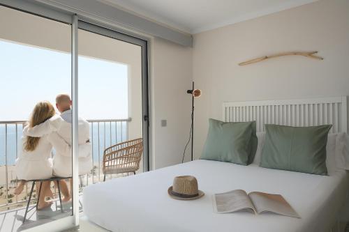 Ένα ή περισσότερα κρεβάτια σε δωμάτιο στο Holidays P14 Sea View