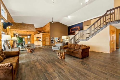 a large living room with couches and a staircase at Quality Inn Superior - Duluth in Superior