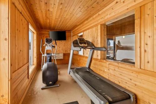 a gym with a treadmill and a camera in a room at Quality Inn Superior - Duluth in Superior