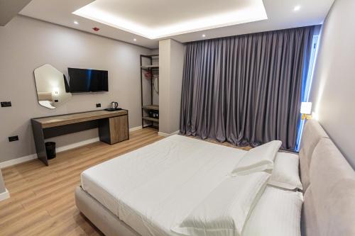 TV a/nebo společenská místnost v ubytování Real Hotel