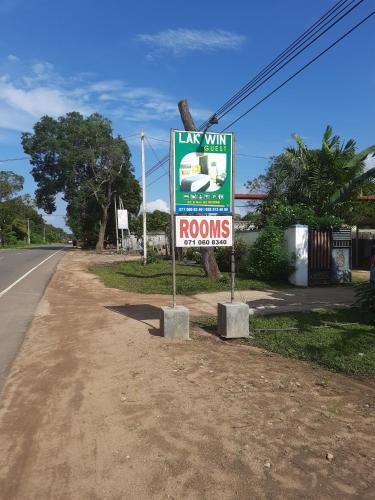 a sign on the side of a road at Wilpattu Lakwin Guest in Pahala Maragahawewa