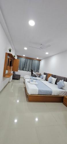a large bedroom with a large bed in a room at Hotel 4 Season in Vadodara