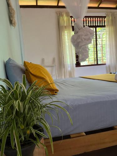 Postel nebo postele na pokoji v ubytování 'Kolamba Gedara' green apartment