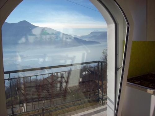 a view of the mountains from a balcony at Casa delle Camelie in Sorico