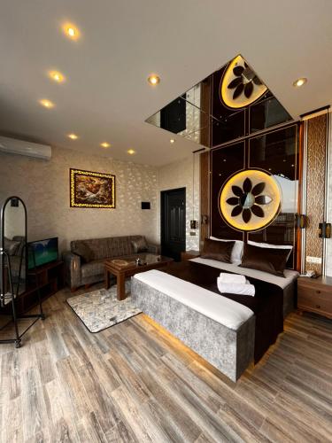 a living room with a couch and a table at Buludlara Yaxın Cloud-Proximate in Şamaxı
