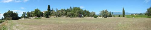 a large field with trees in the background at Mas de Regardebon in Mazan