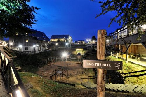 a sign that reads ring the bell at night at Ethno Houses Plitvice Lakes Hotel in Plitvica selo