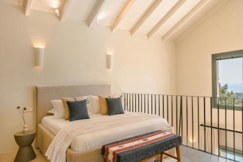Ένα ή περισσότερα κρεβάτια σε δωμάτιο στο Thymisis Villa 2