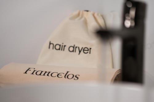 a book with a shopping bag with the words hair dye and faggots at Granxa D Outeiro in Ribadavia