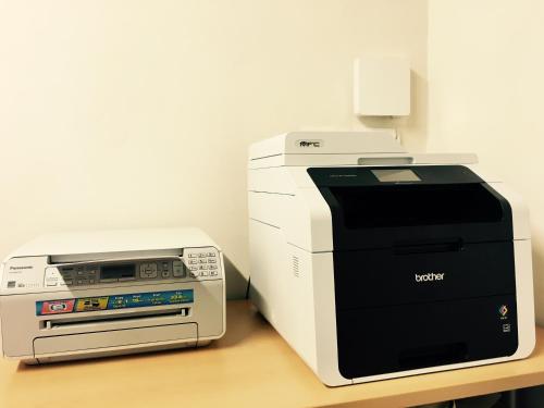 a computer and printer sitting on a table at Agriturismo San Galgano in Chiusdino