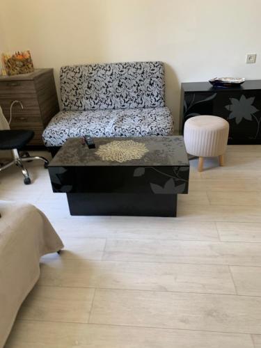 a living room with a couch and a coffee table at Erebuni in Yerevan
