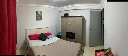 Giường trong phòng chung tại Apartamento aconchegante