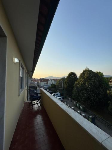 a balcony with a view of a parking lot at Varanda do Coura in Caminha