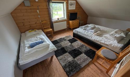 Postel nebo postele na pokoji v ubytování Lapland Snow Cabin