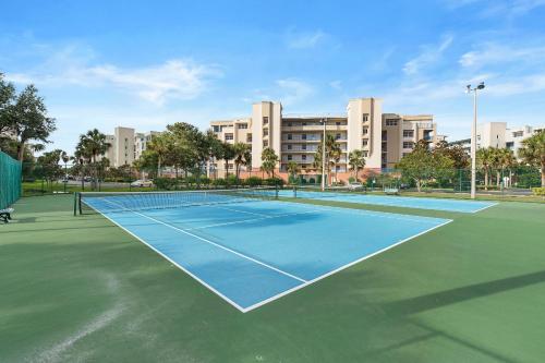 a tennis court in front of a building at Oceanwalk 9-604 in New Smyrna Beach