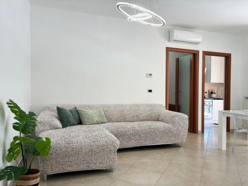 a living room with a couch and a table at Holihome Mondo Serena in Tortoreto Lido
