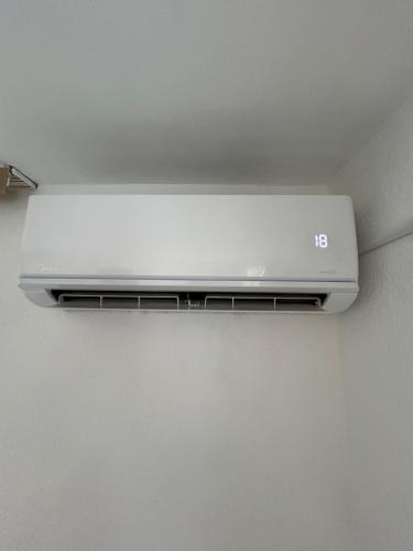 a laptop is hanging from a ceiling at Apartman Biser in Sarajevo