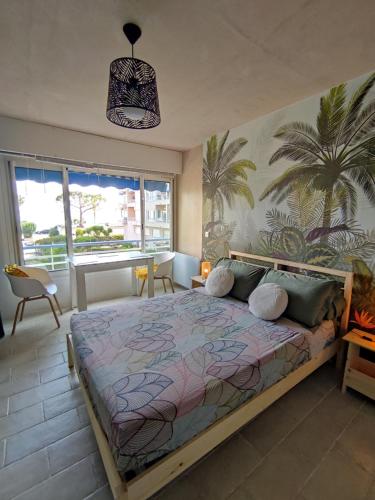 Ένα ή περισσότερα κρεβάτια σε δωμάτιο στο Studio vue mer