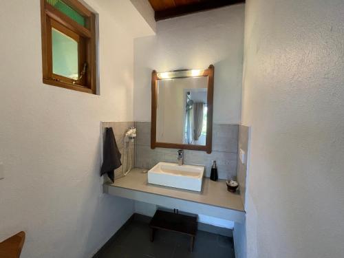 a bathroom with a sink and a mirror at Zion View Ella Green Retreat in Ella