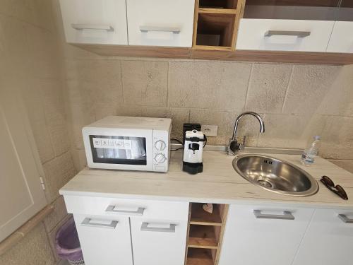 Dapur atau dapur kecil di Santa Caterina Home suite