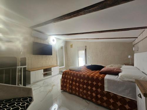 Katil atau katil-katil dalam bilik di Santa Caterina Home suite