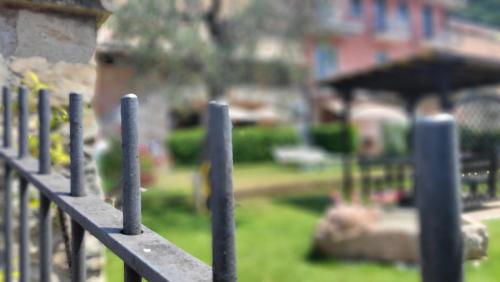 a metal fence with a park in the background at Villa Josefine Lake Front - Adults Only in Brenzone sul Garda