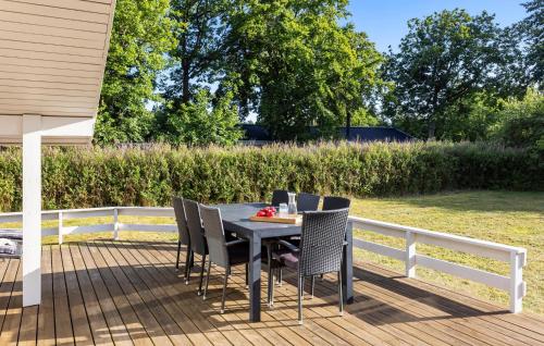 a table and chairs sitting on a deck at Stunning Home In Humble With Wifi in Humble