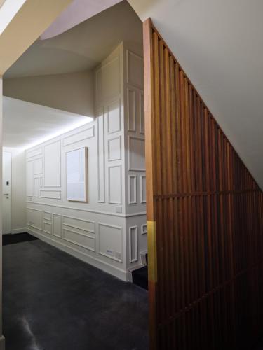 a hallway with a wooden door in a room at San Domenico in Ravenna