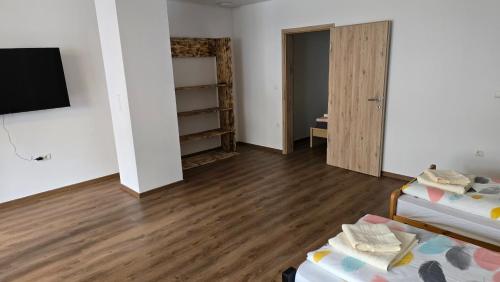 a room with a bed and a tv and a closet at Apartma Alja 4 Kranjska Gora in Kranjska Gora