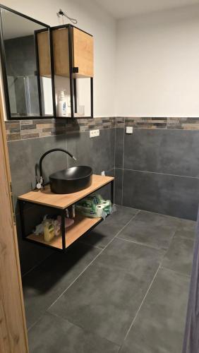 a bathroom with a sink and a counter top at Apartma Alja 4 Kranjska Gora in Kranjska Gora
