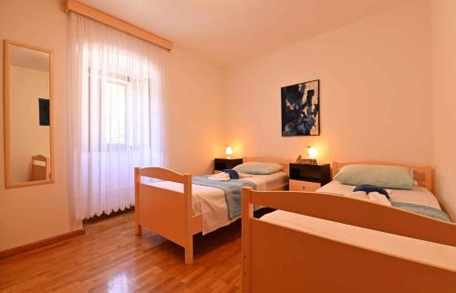 Ένα ή περισσότερα κρεβάτια σε δωμάτιο στο Apartment in Plomin - Istrien 8772