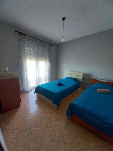 Katil atau katil-katil dalam bilik di Karvali Home Eleni