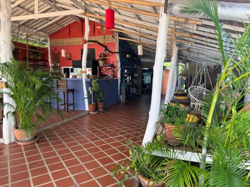 a room filled with lots of plants in a building at SeaEsta Beach in Baan Tai