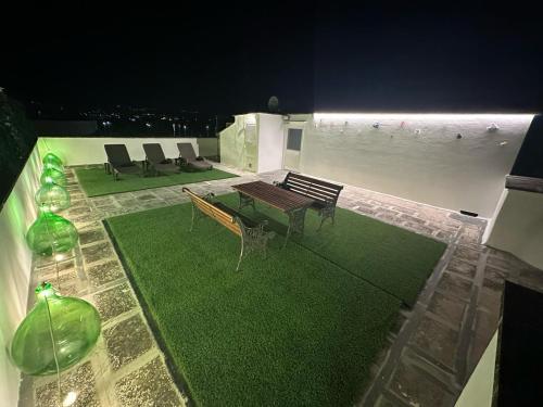 a room with a table and chairs on a building at Boga & Vopa House in Savelletri di Fasano