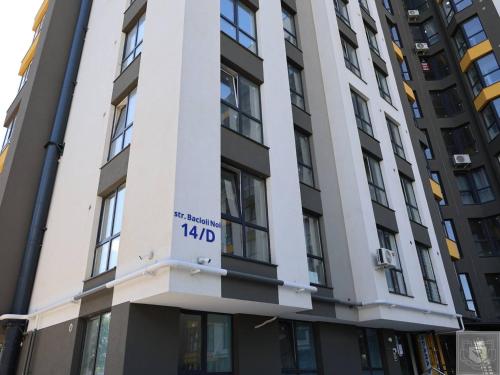 a sign on the side of a building at RentHouse Apartments - Airport Loft in Chişinău