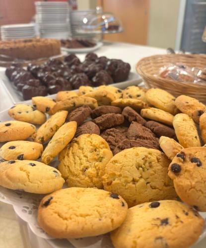 a plate of cookies and other desserts on a table at Park Hotel Sancelso in Bellamonte