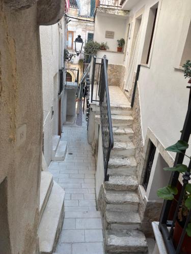 an alley with stairs in an old building at La Casetta in Ischitella
