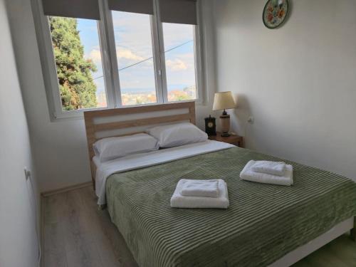 Postel nebo postele na pokoji v ubytování City Peaks Apartments