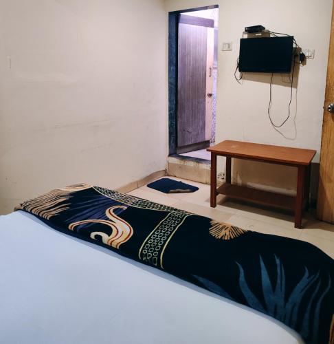 Ein Bett oder Betten in einem Zimmer der Unterkunft Hotel Kolkar