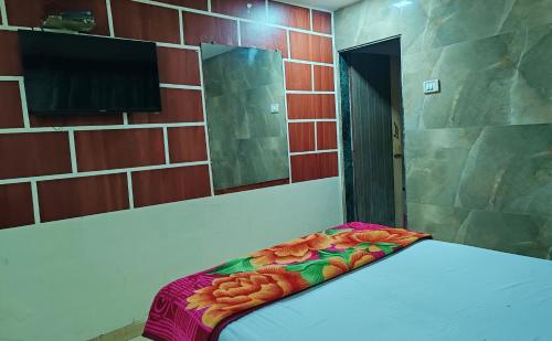 Ein Bett oder Betten in einem Zimmer der Unterkunft Hotel Kolkar