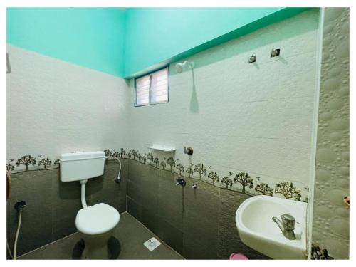 Ένα μπάνιο στο THIRUNALLAR Udhayam Residency INN