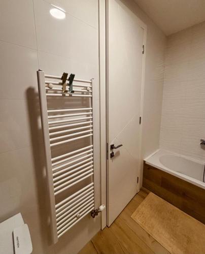 a bathroom with a toilet and a sink and a tub at Parkpoint in Banja Luka