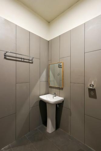 a bathroom with a sink and a mirror at Breeze Resort Panhala , Swimming Pool, Just 5 Minutes From Panhala! in Panhāla