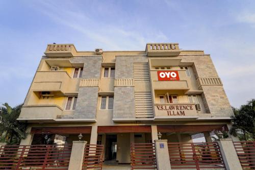 a building with a sign on the front of it at Hotel O Senthamizh Residency in Chennai