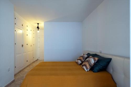 a room with a bed with two pillows on it at Villa Mar Rompido in El Rompido