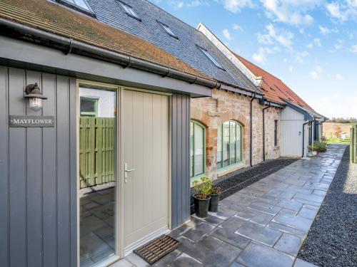 an internal courtyard of a house with a garage at Mayflower - Uk43632 in Grange