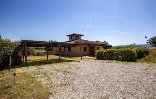 a small building with a tower on top of it at Amazing Home In Barberino Tavarnelle in Barberino di Val dʼElsa