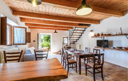 a kitchen and dining room with a table and chairs at Gorgeous Home In Loc Avenale, Cingoli in Avenale