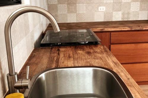 a kitchen counter with a sink and a sink at New apartment in a quiet area of Arequipa in Arequipa