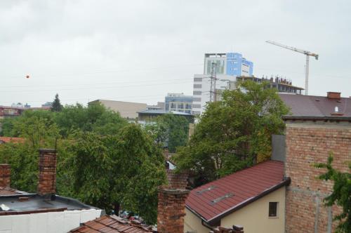 a view of a city with buildings and trees at Csikos Apartment in Cluj-Napoca